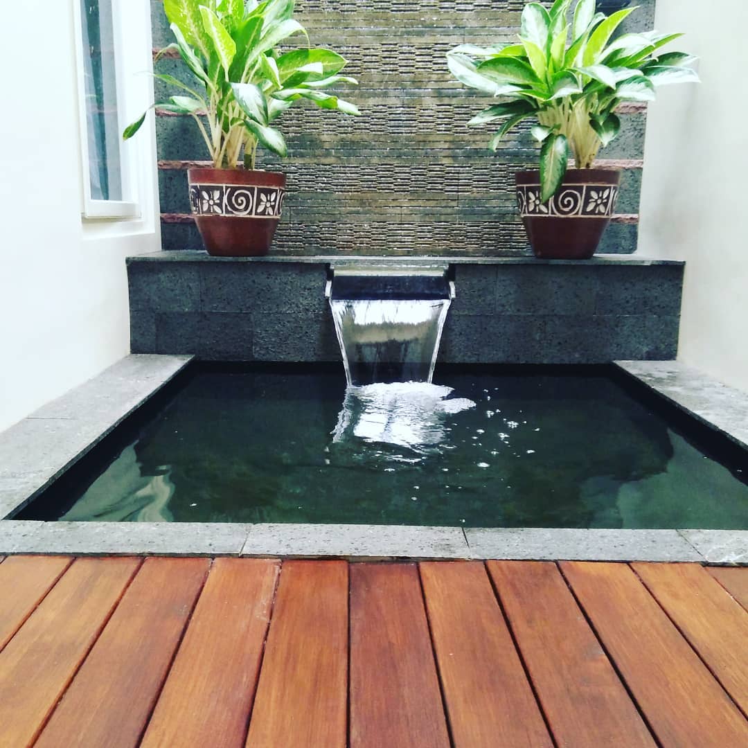 Minimalist Fish Pond with a Simple Waterfall