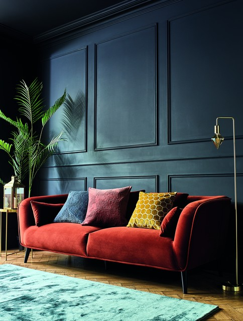 Orange Velvet Sofa in A Navy Living Room that Will Draw Attention