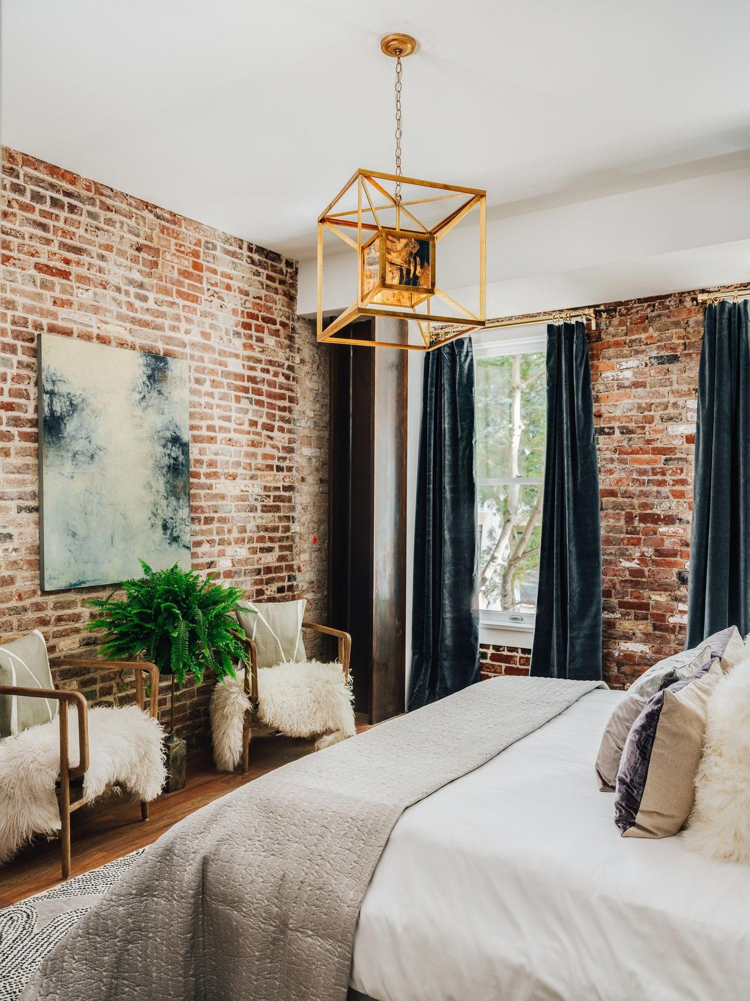 Industrial Bedroom with Golden Accents