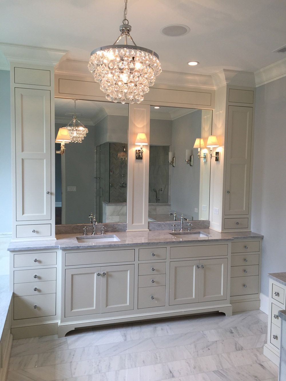Luxurious White Bathroom With A Chandelier