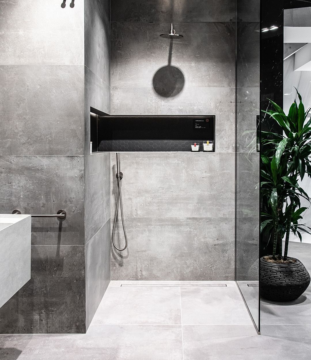 Luxurious Industrial Bathroom with Black Shower Niche