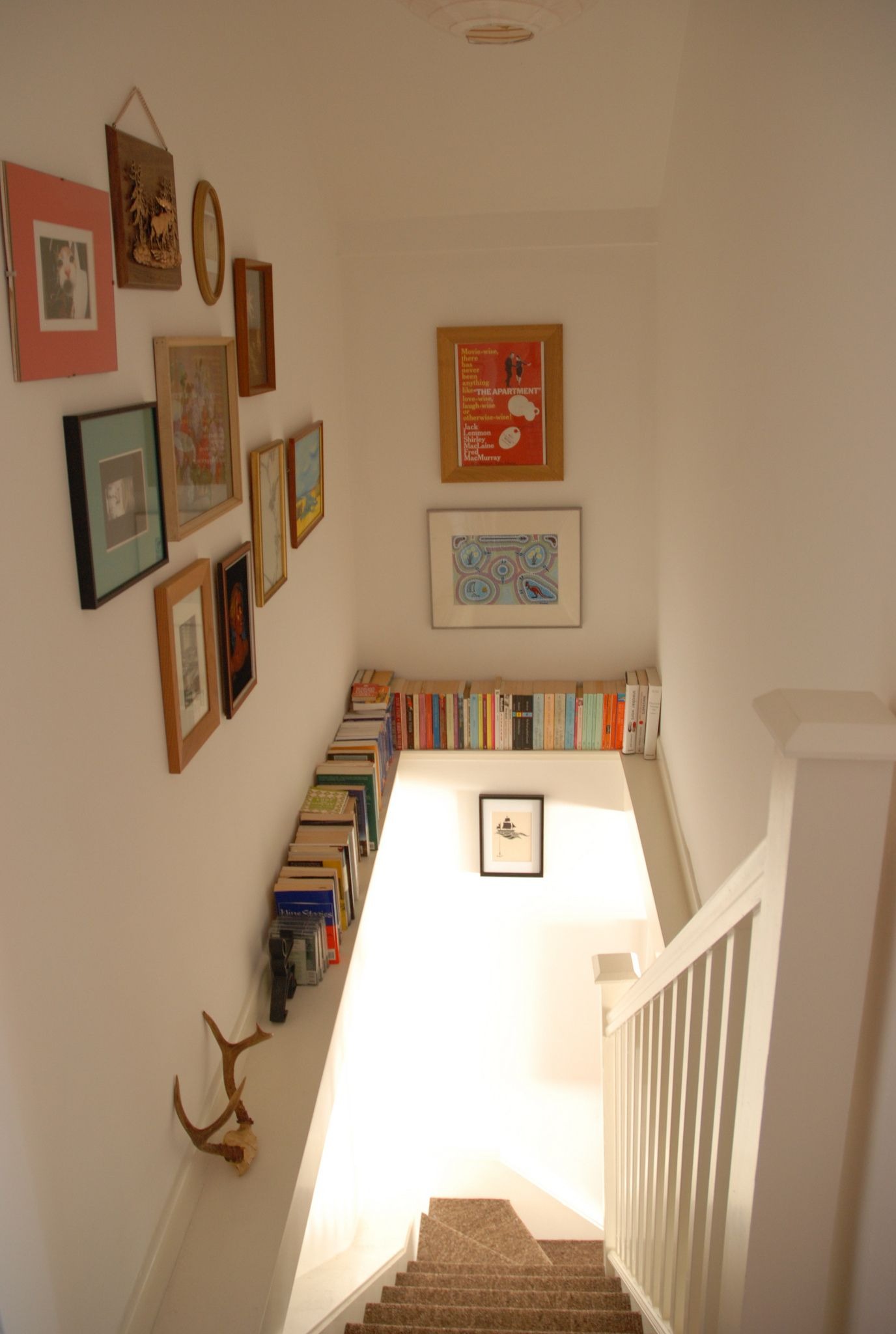 Wall Bookshelf for A Staircase Landing Area